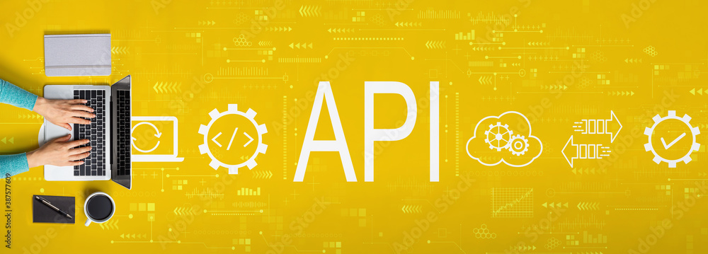 API - application programming interface concept with person using a laptop computer