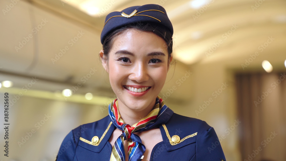 Cabin crew or air hostess working in airplane . Airline transportation and tourism concept.