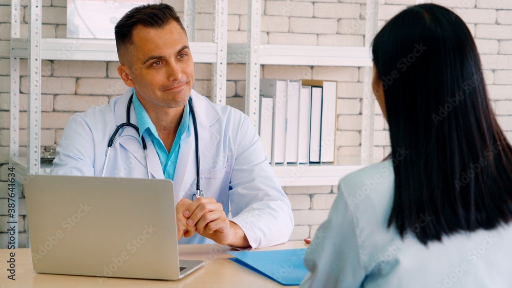 Doctor in professional uniform examining patient at hospital or medical clinic. Health care , medica