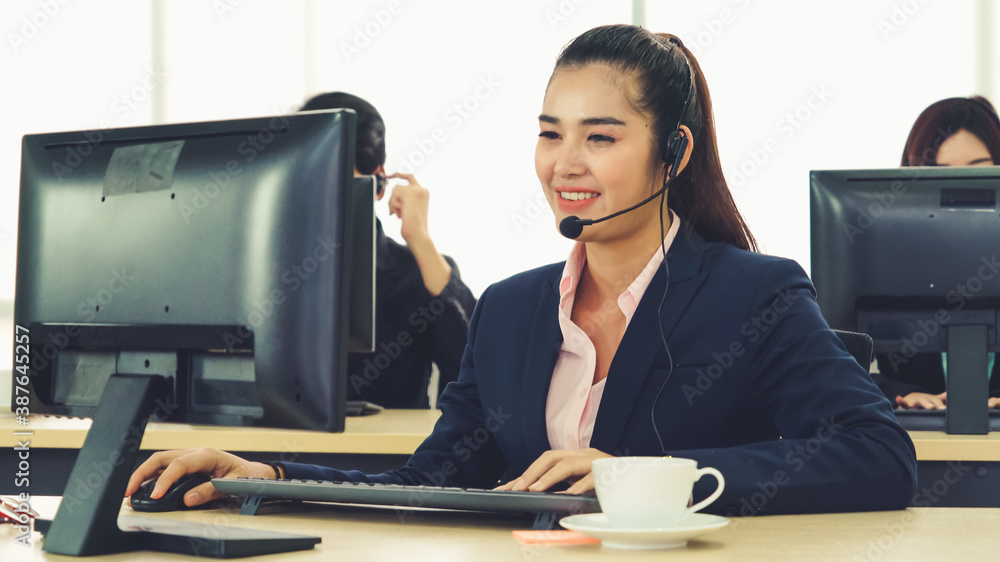 Business people wearing headset working in office to support remote customer or colleague. Call cent