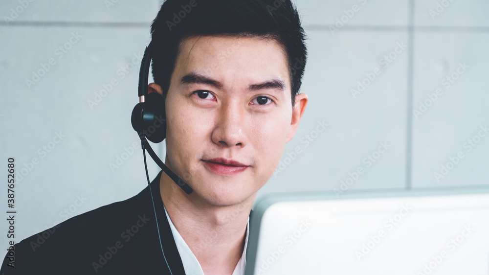 Business people wearing headset working in office to support remote customer or colleague. Call cent