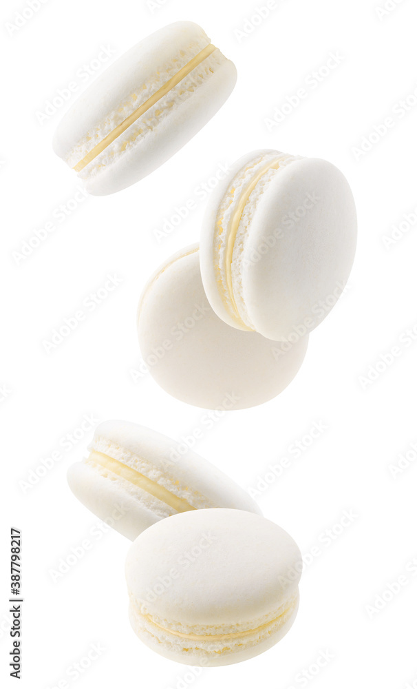 Isolated white macaroons. Five vanilla macaroons falling down over white background