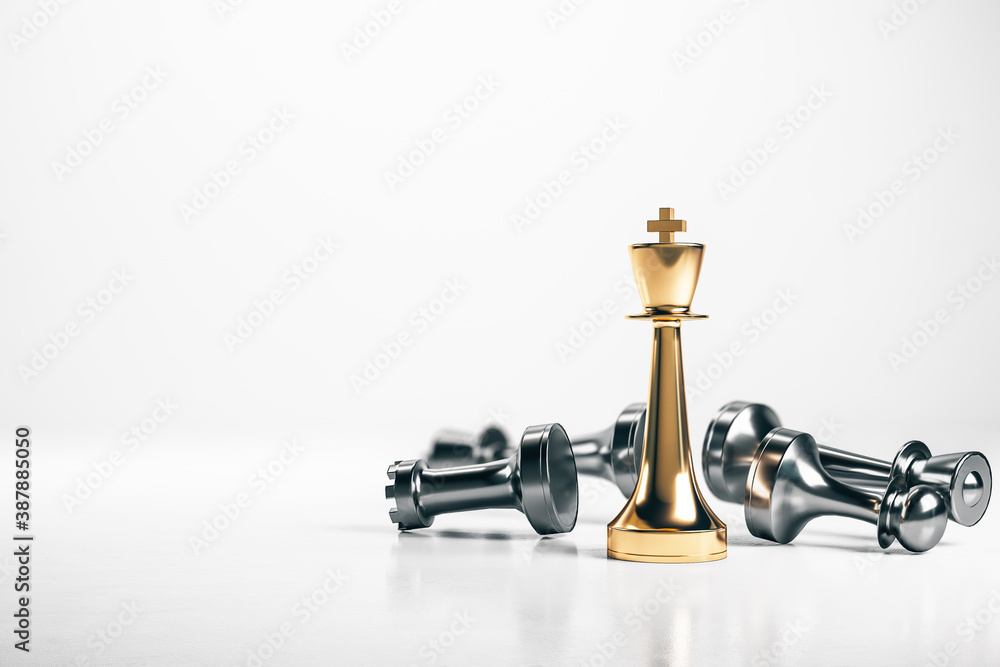 Golden king chess piece and silver lying pawns