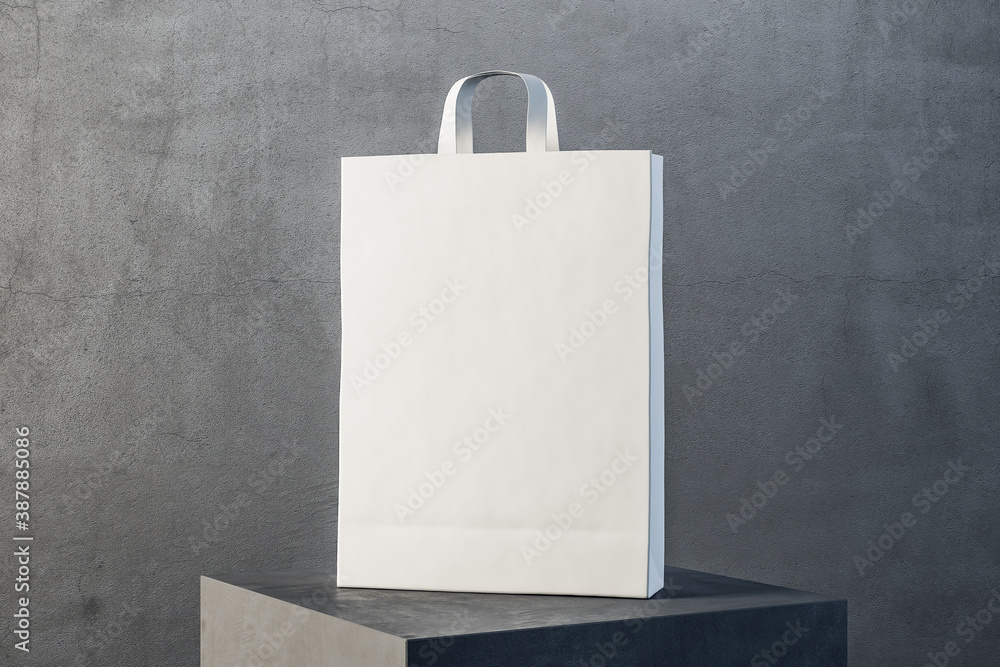 White paper bag with handles on podium.