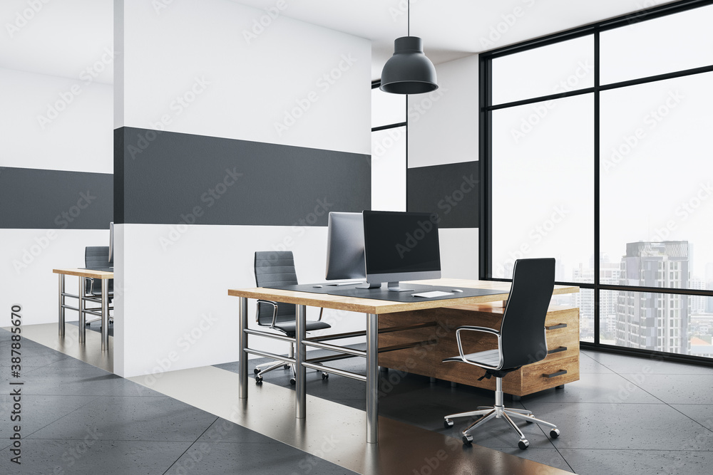 Modern office interior with rows of computer table.