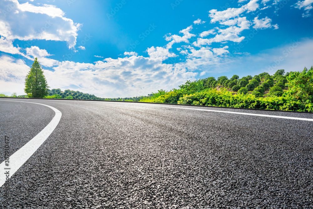 Countryside asphalt road and green tea plantations with mountain natural scenery in Hangzhou on a su