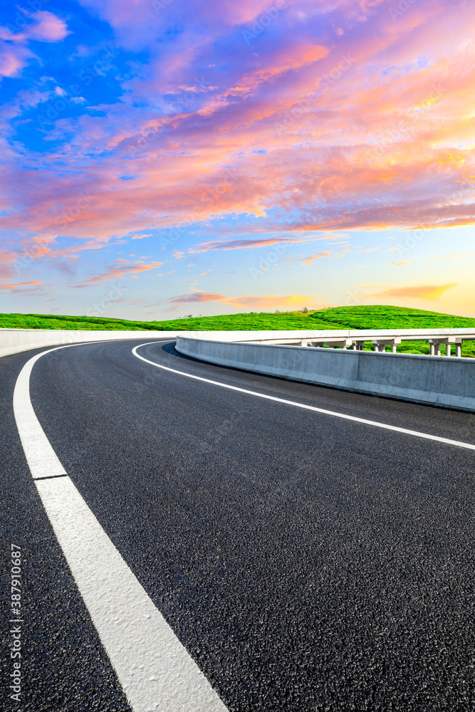 Countryside asphalt road and green tea plantations with mountain natural scenery in Hangzhou at sunr