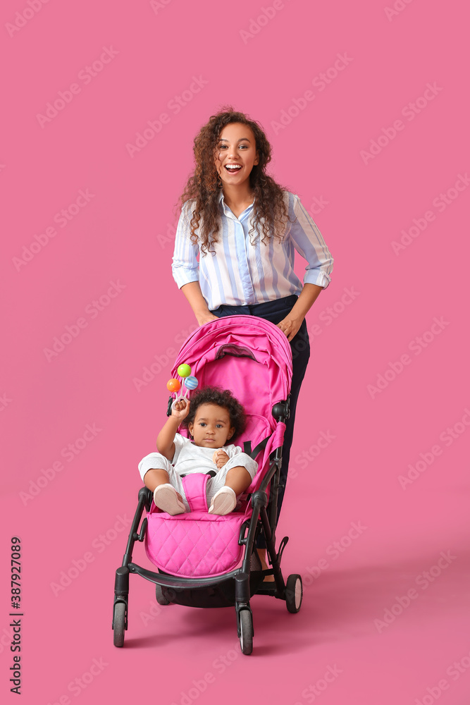 African-American woman and her cute baby in stroller on color background