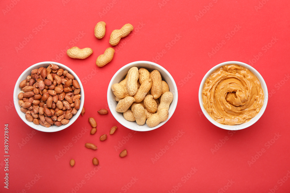 Composition with tasty peanut butter on color background