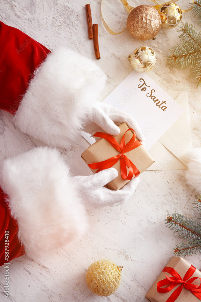 Santa with Christmas gift on white background