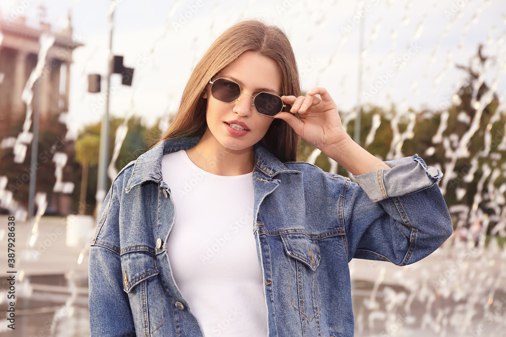 Beautiful woman with stylish sunglasses outdoors