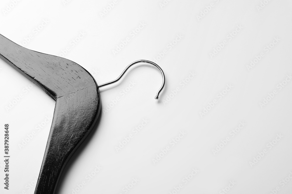 Clothes hanger on light background