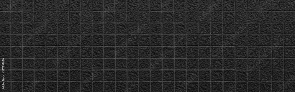 Panorama of Modern black mosaic wall tile texture and seamless background