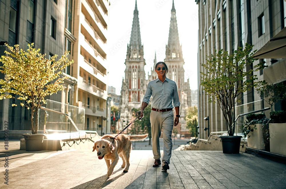 Man with dog in the city