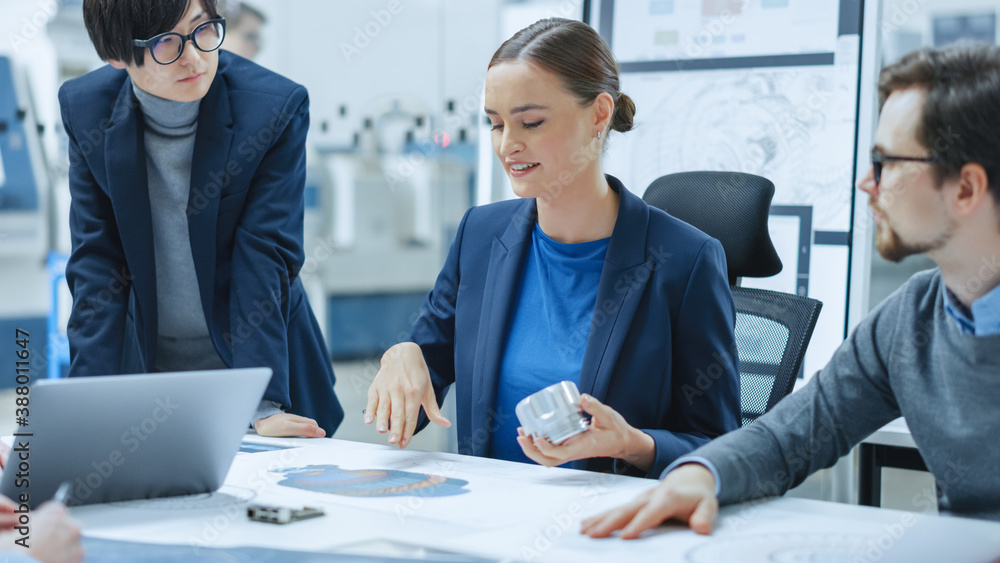 Modern Factory Office Meeting Room: Young Female Specialist Reports to Diverse Team of Engineers, Ma