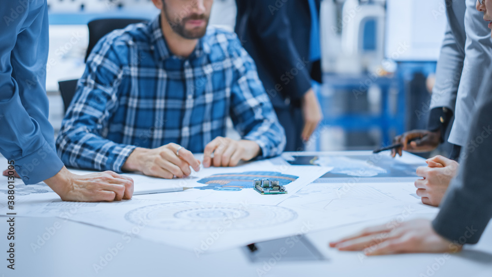 Busy Diverse Team of Computer Engineers and Specialists Gather Around Conference Table and Discuss E