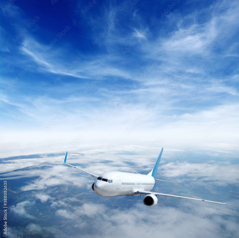 Airplane in the sky. Passenger Airliner in clouds.