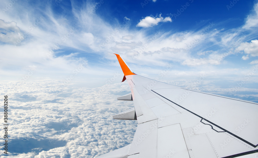 View from airplane window with blue sky