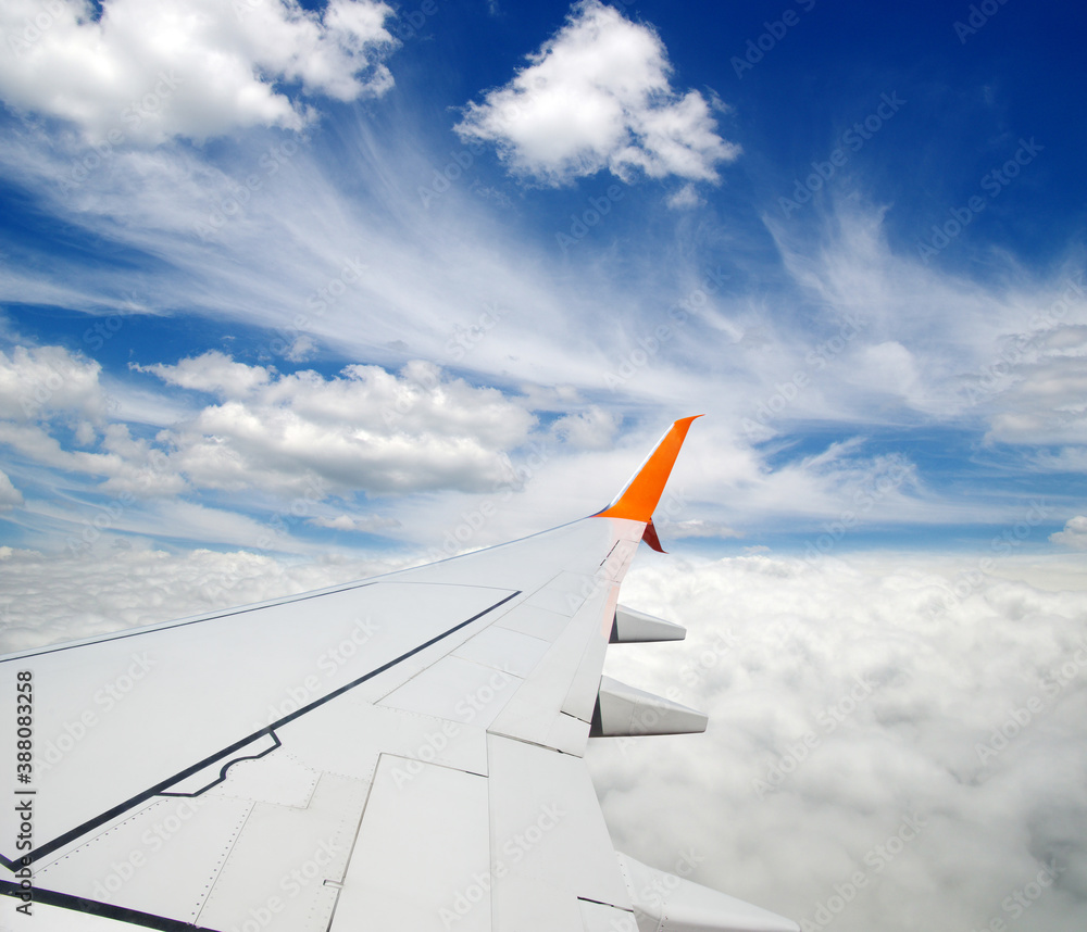 View from airplane window with blue sky