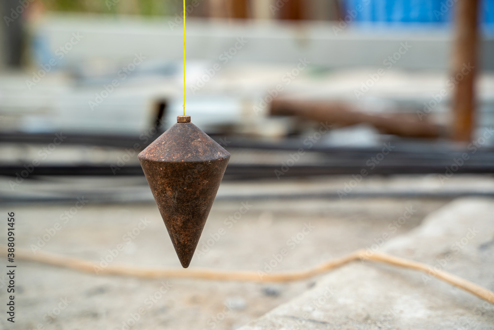 Plumb for level measurement at construction site.