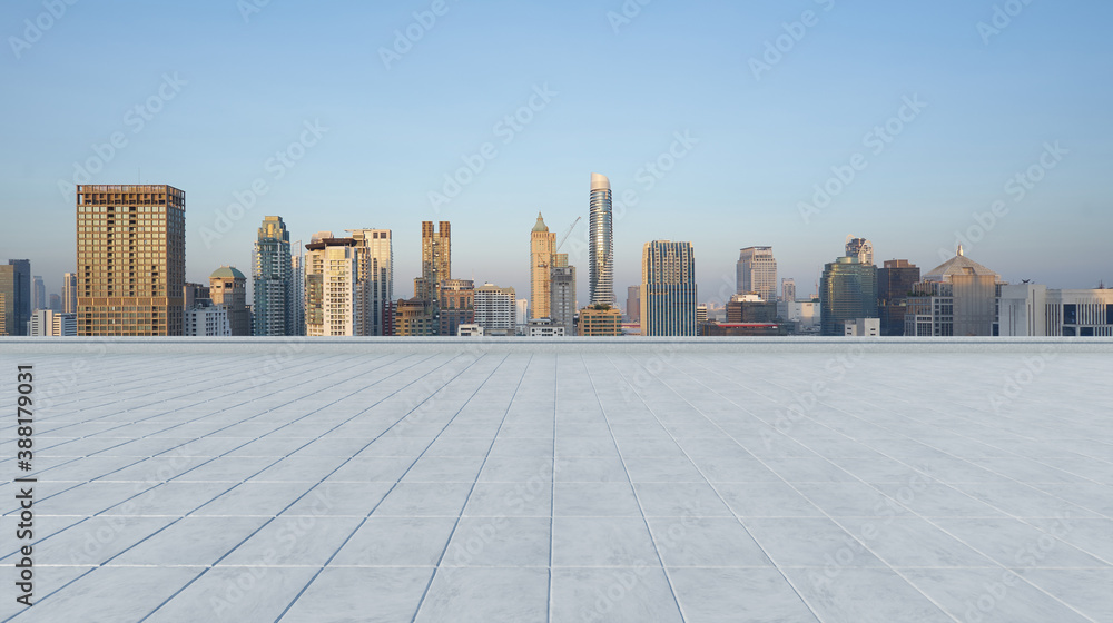 Empty concrete tiles floor with city