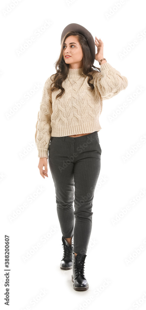 Stylish young woman in autumn clothes on white background