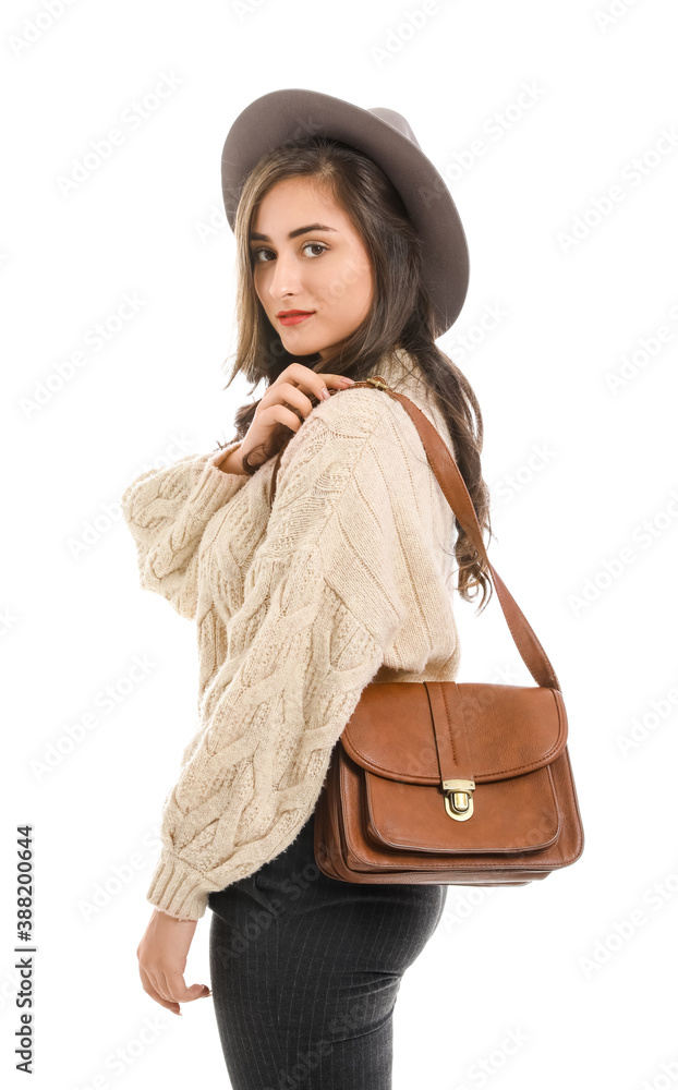 Stylish young woman in autumn clothes on white background