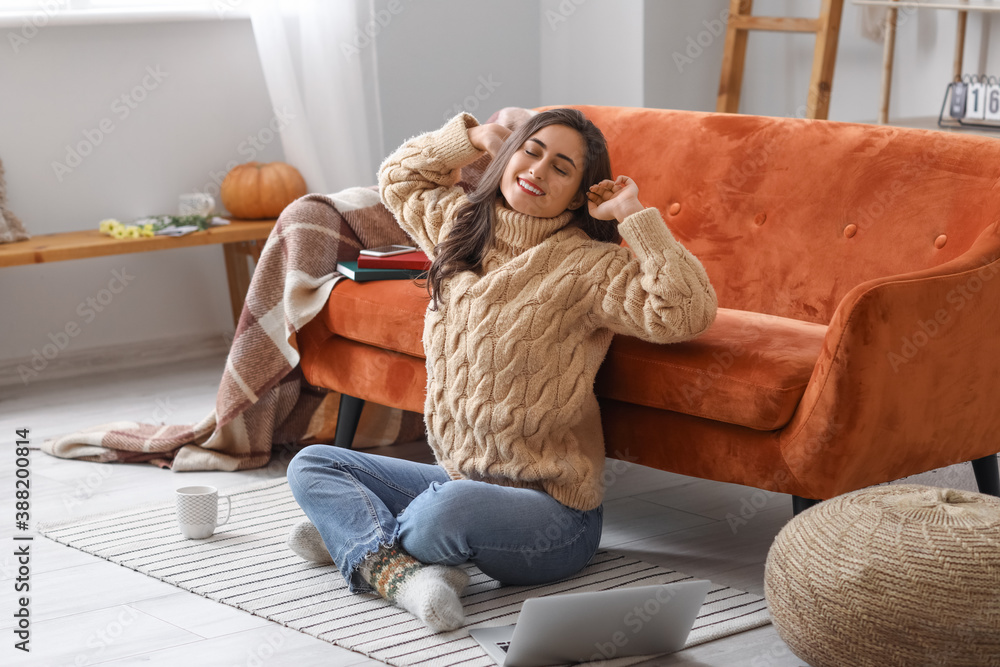 Beautiful young woman resting at home