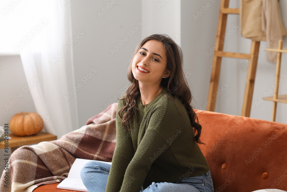 Beautiful young woman resting at home