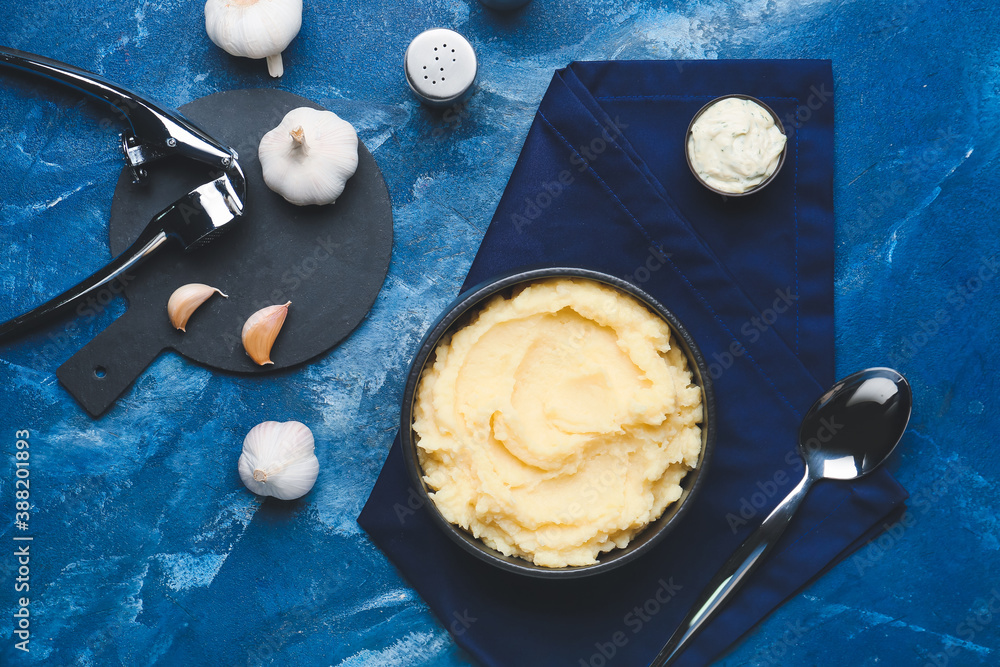 Composition with tasty mashed potato and garlic on table