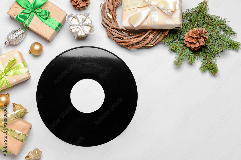 Vinyl disk and Christmas decor on light background