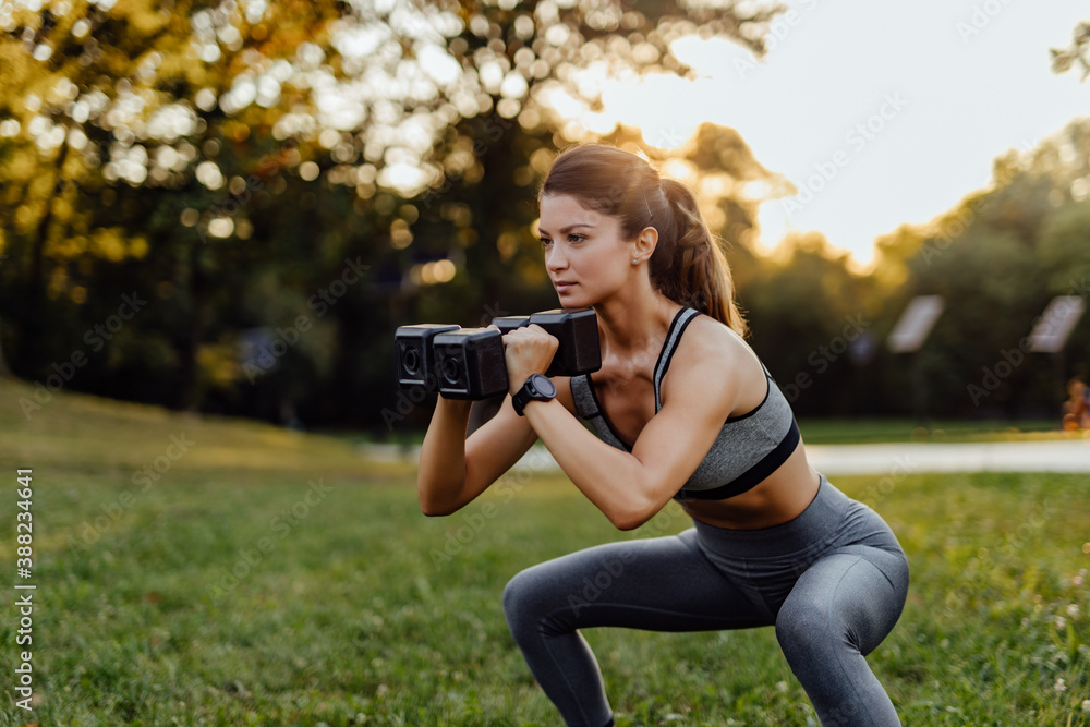 Having ponytail and dressed in a sport outfit.