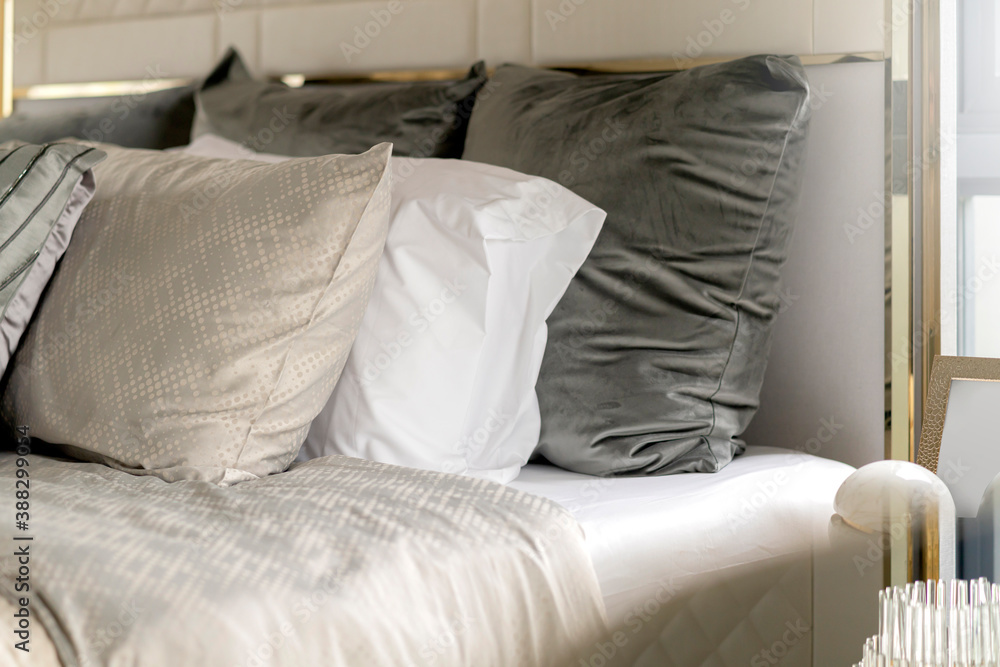 close up white beige soft pillows on bed and blanket bedroom interior design concept.bed maid luxury