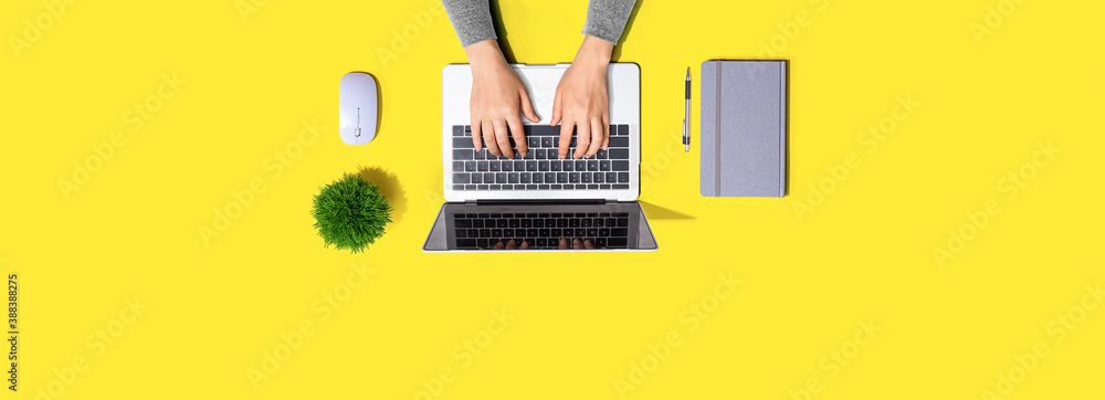 Person using a laptop computer from above