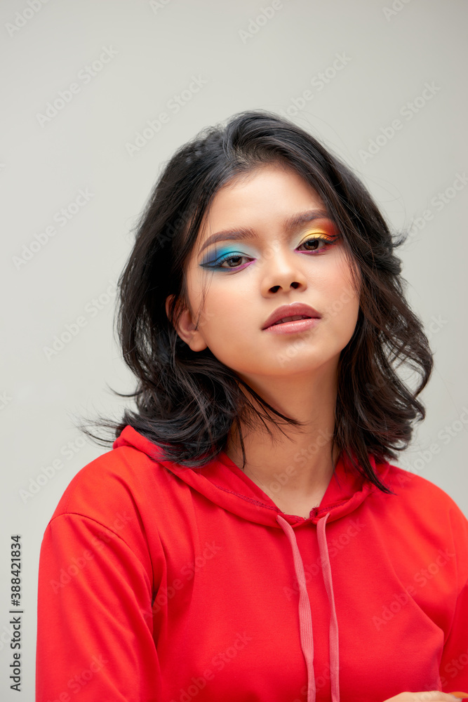 Girl with colorful makeup and manicure