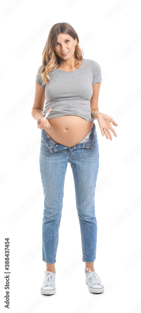 Beautiful pregnant woman with test on white background