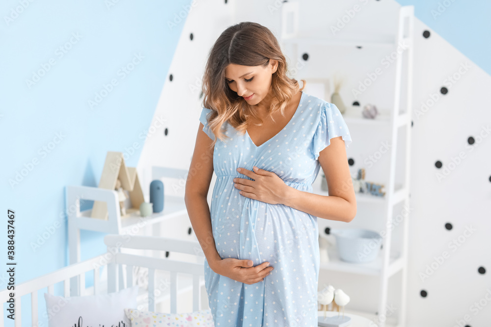 Beautiful pregnant woman at home