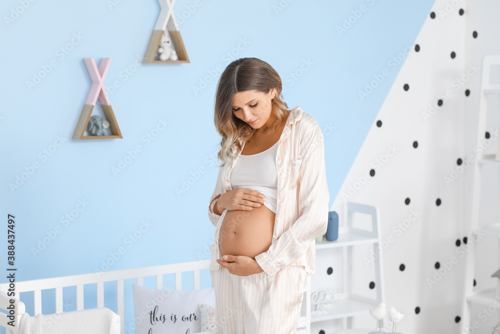 Beautiful pregnant woman at home