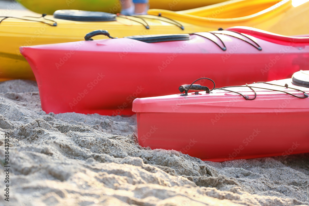 Boats for kayaking on river bank