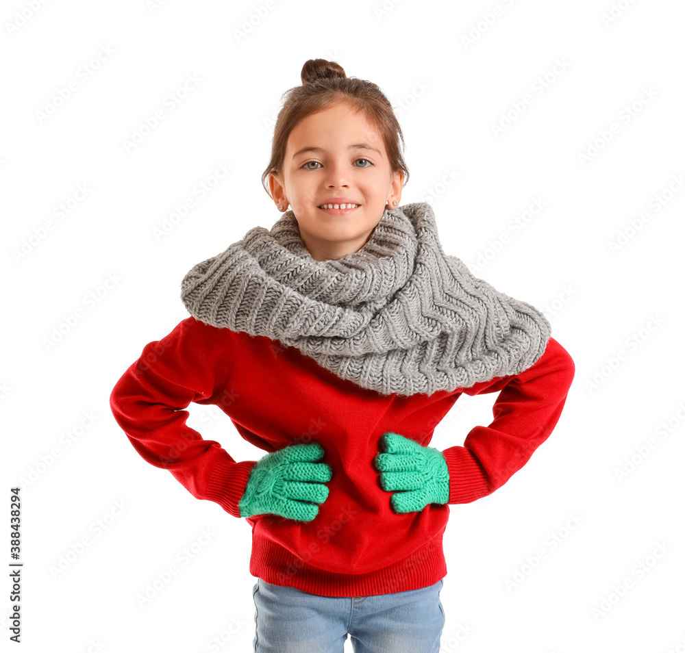 Cute girl in winter clothes on white background