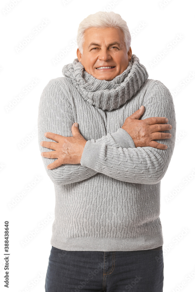 Mature man in winter clothes on white background