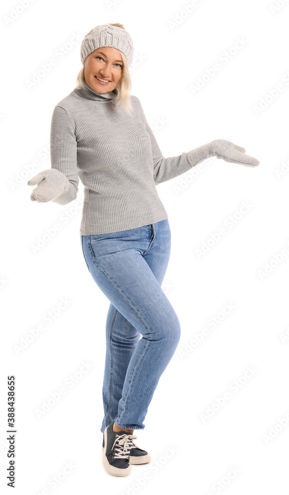 Mature woman in winter clothes on white background