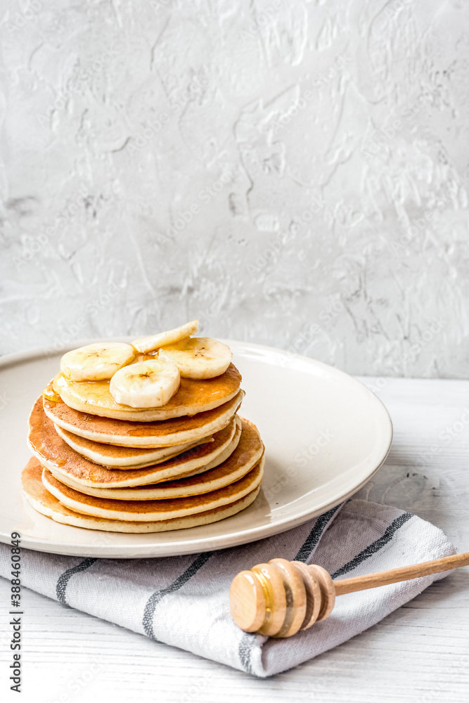 cooked pancake on plate at wooden background