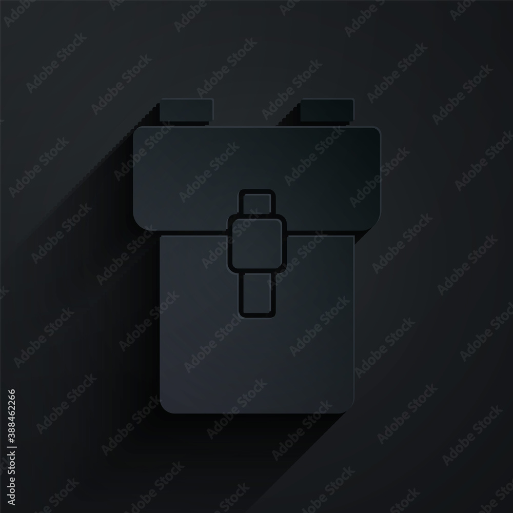 Paper cut School backpack icon isolated on black background. Paper art style. Vector.