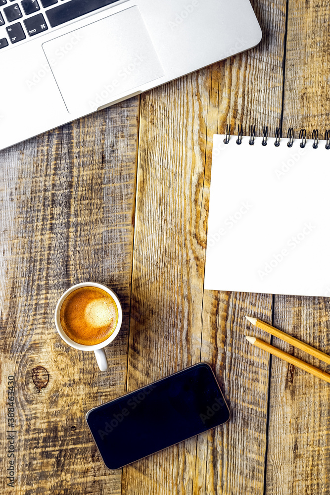 Working place with notebook on wooden table