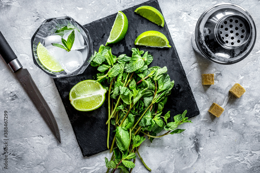 making mojito on stone background top view