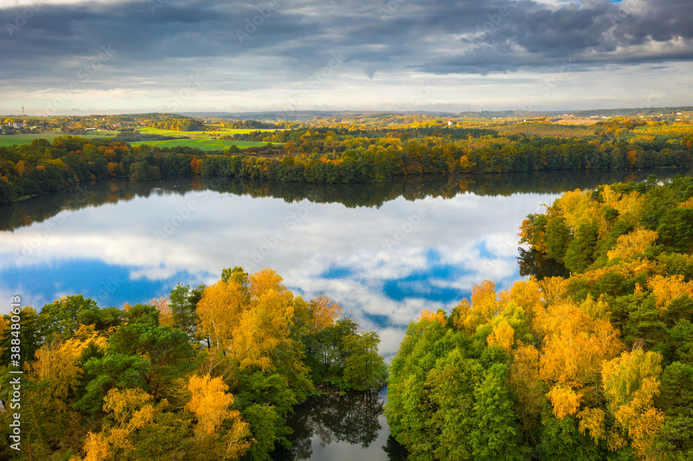 Golden autumn of Poland by the Straszyn lake from above.