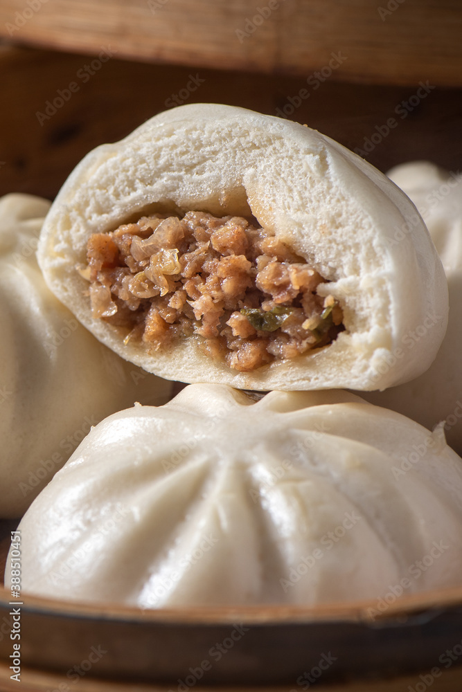 Close up of fresh delicious baozi, Chinese steamed meat bun.