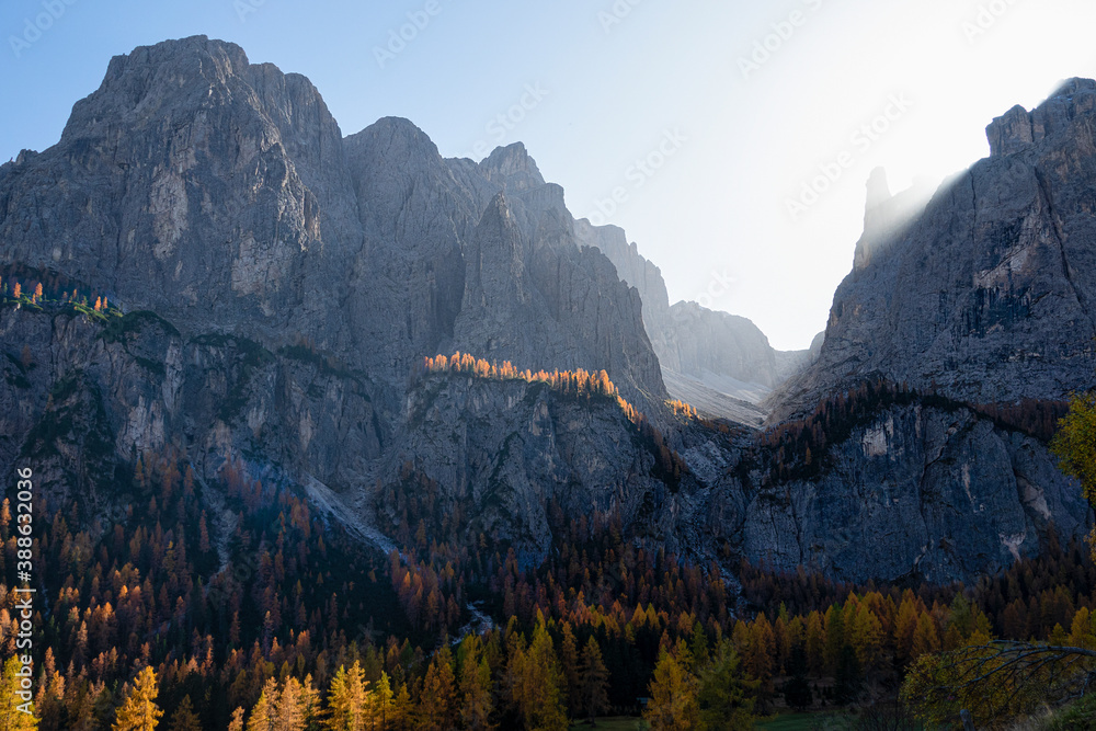 CLOSE UP: Bright autumn sunbeams shine on the rocky peaks of the Dolomites.