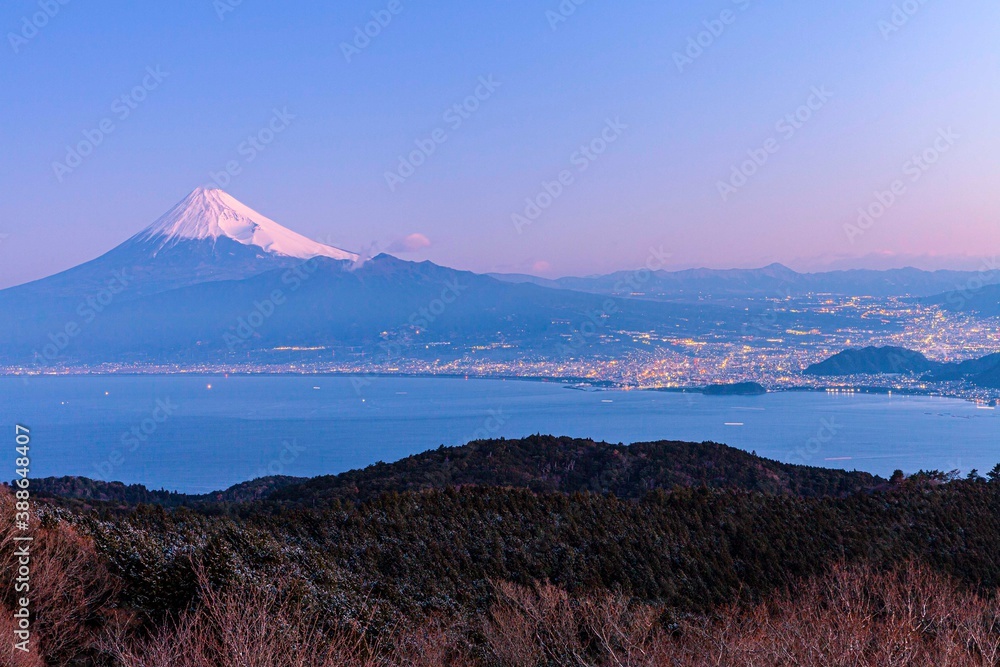 Mount Fuji and Numazu City lights in winter morning